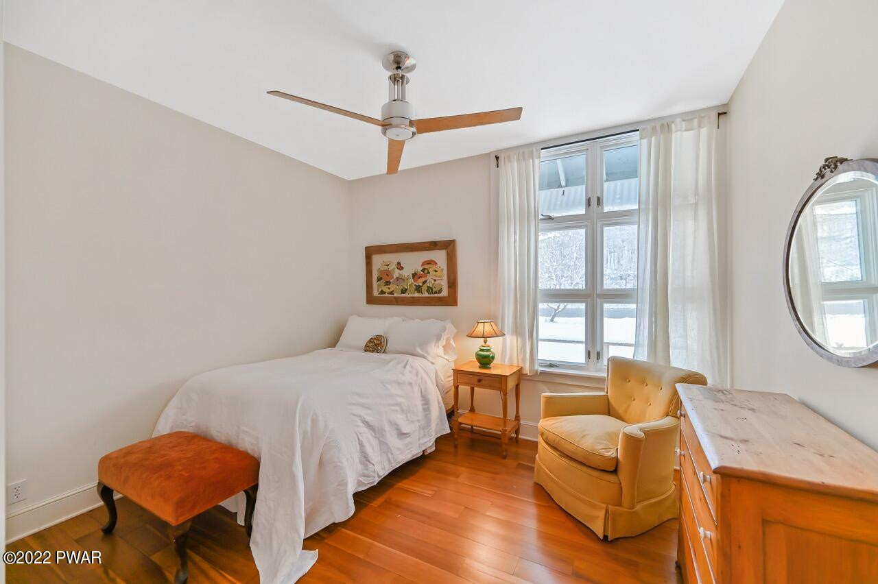 45 Tammany Flats Road Damascus, PA 18415 - Photo 50 of 73 a bedroom with a bed and wooden floor