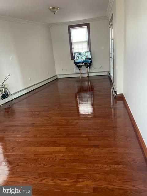 10 Middle Road Levittown, PA 19056 - Photo 5 of 25 a view of empty room with wooden floor and fan