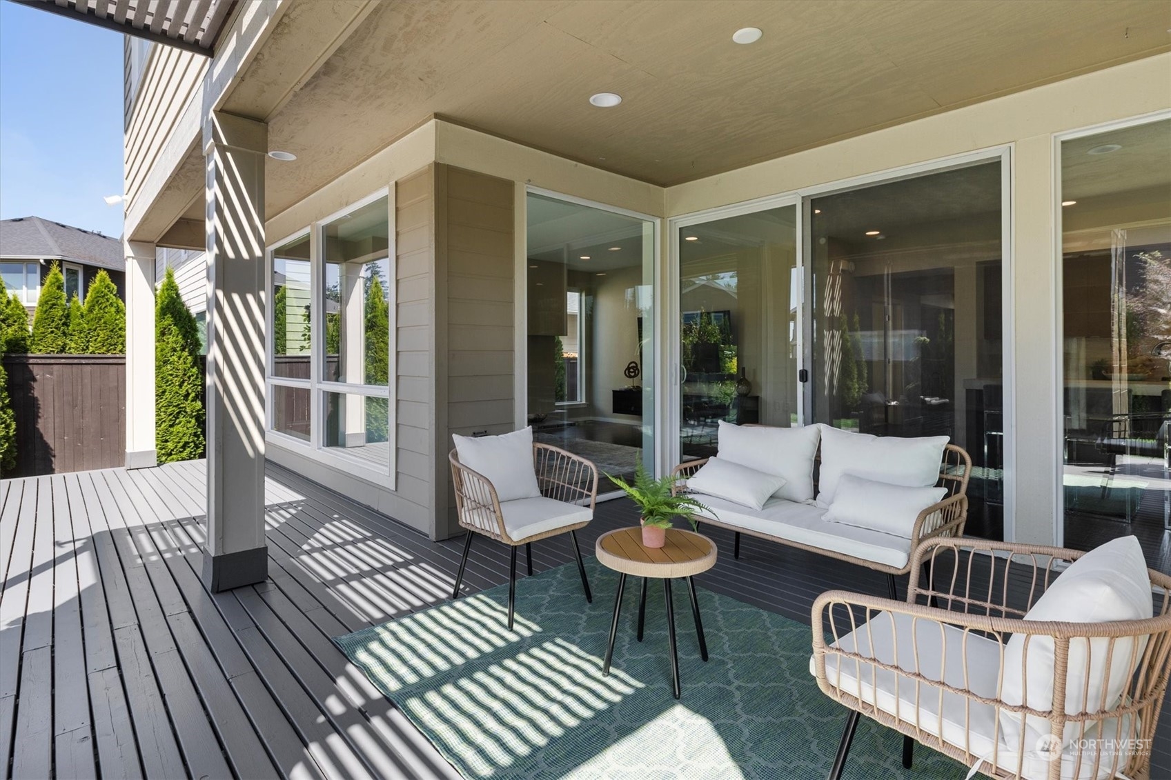 3835 Northeast 24th Court Renton, WA 98056 - Photo 17 of 40 a outdoor space with patio the couches and a dining table with garden view