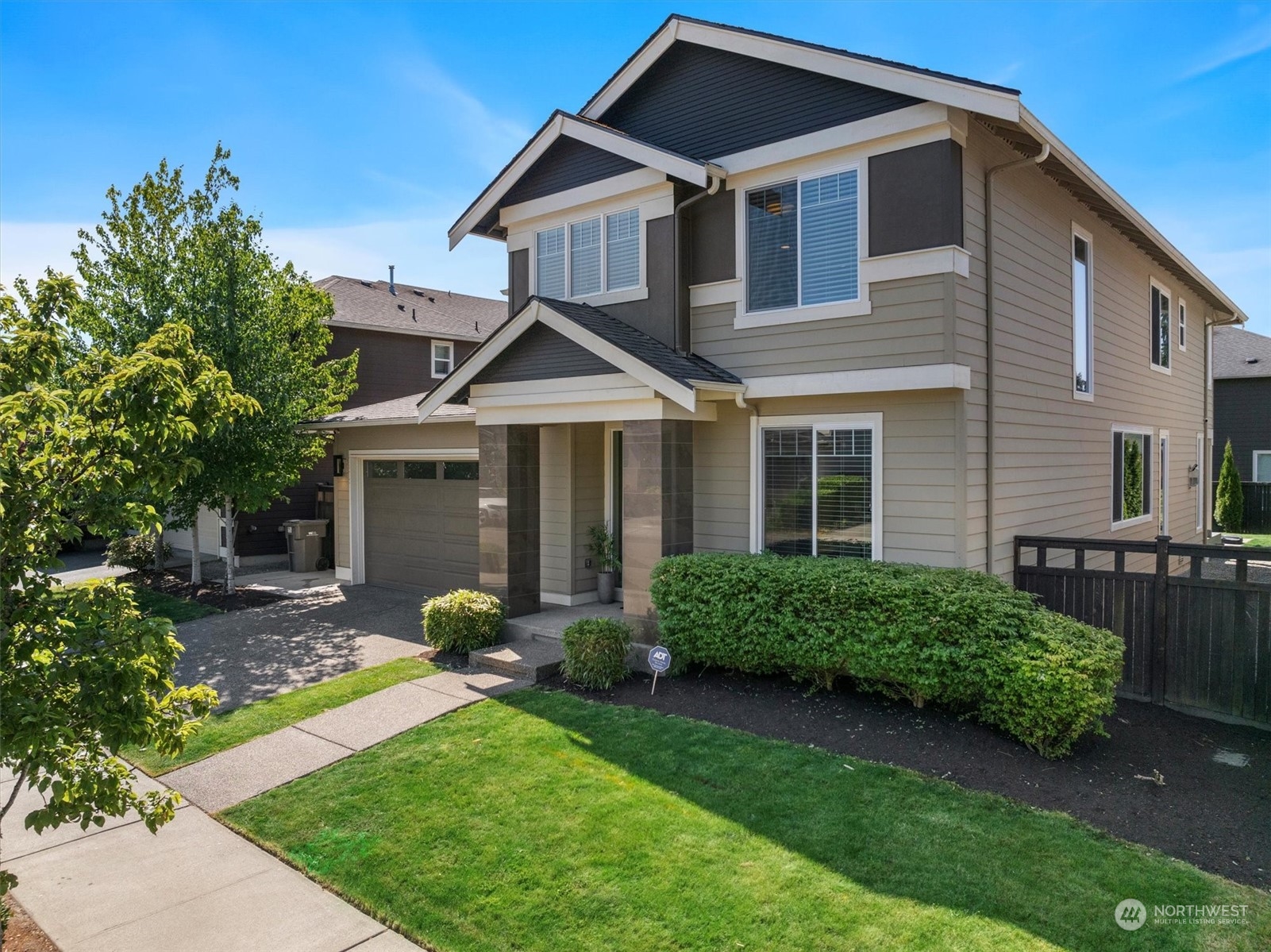 3835 Northeast 24th Court Renton, WA 98056 - Photo 2 of 40 a front view of a house with garden