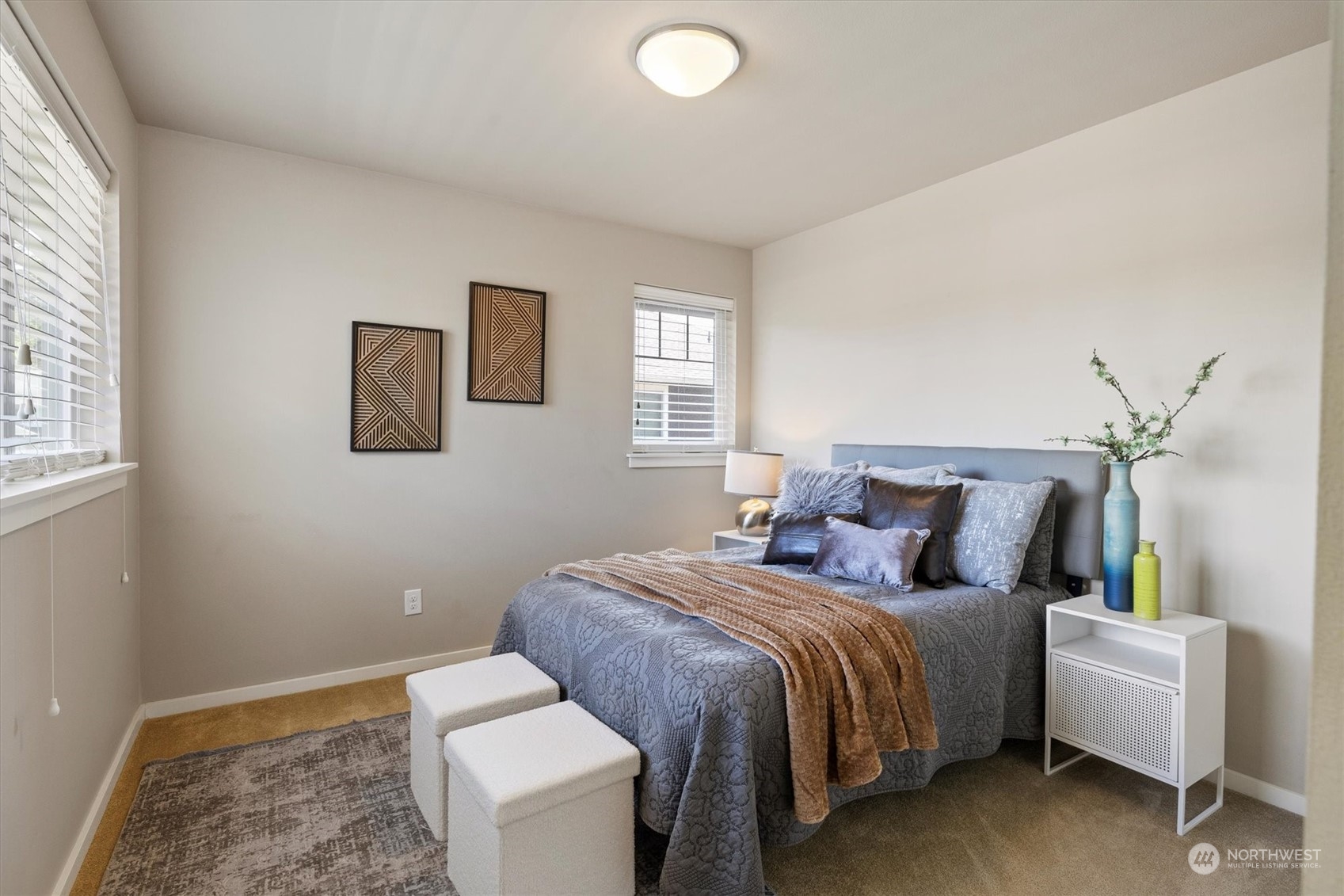 3835 Northeast 24th Court Renton, WA 98056 - Photo 29 of 40 a bedroom with a bed and a couch