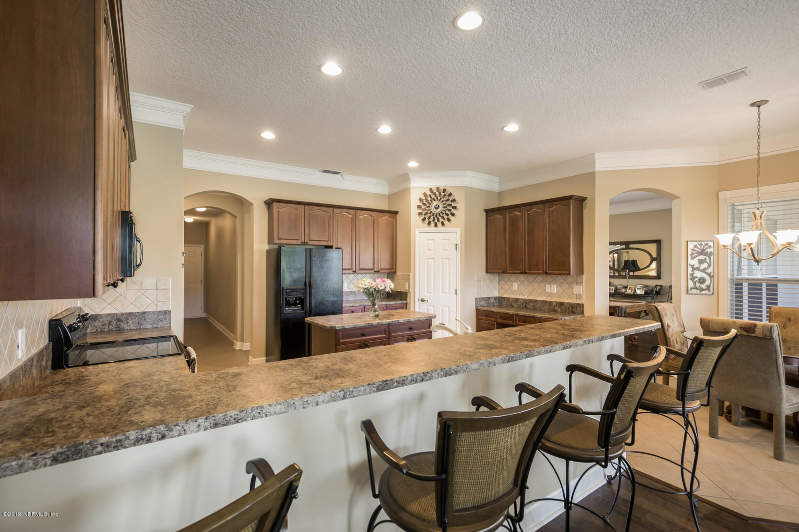 2034 River's Own Road St. Augustine, FL 32092 - Photo 17 of 40 a large kitchen with granite countertop a large counter top appliances and cabinets