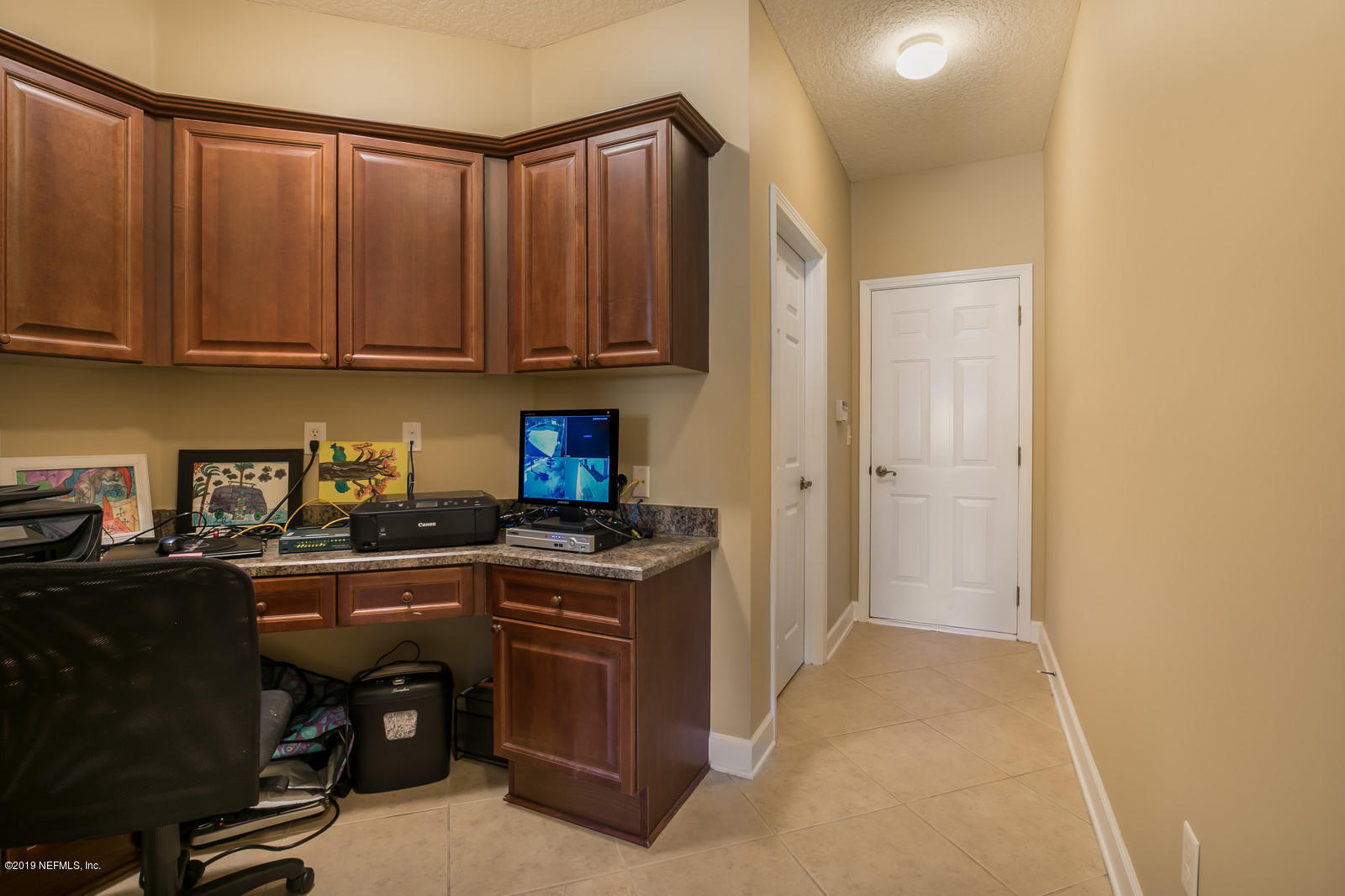 2034 River's Own Road St. Augustine, FL 32092 - Photo 19 of 40 a kitchen with granite countertop a sink dishwasher stove and cabinets