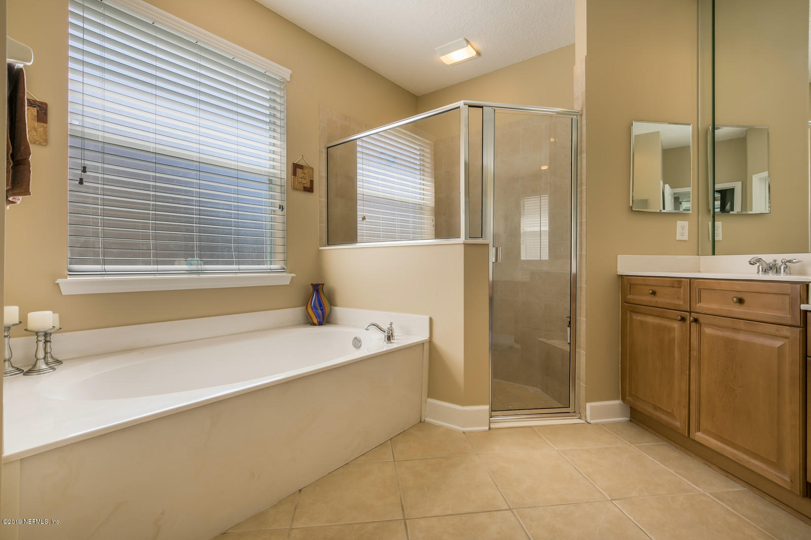 2034 River's Own Road St. Augustine, FL 32092 - Photo 26 of 40 a bathroom with a bathtub and a sink