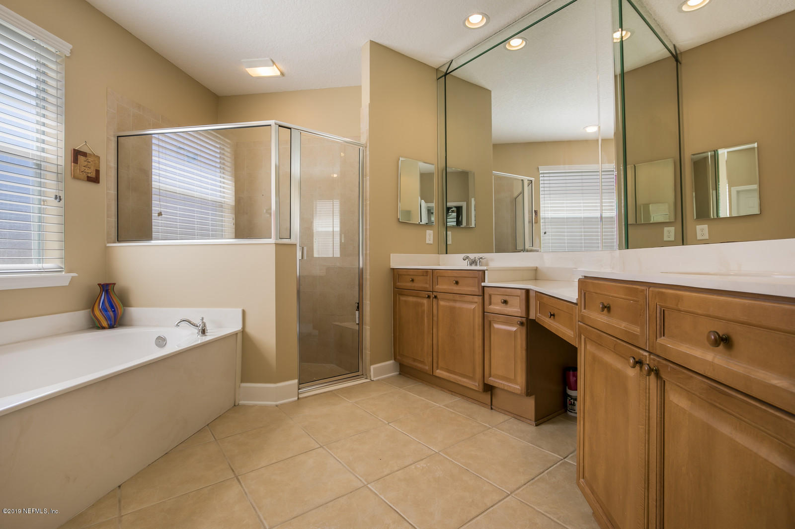 2034 River's Own Road St. Augustine, FL 32092 - Photo 27 of 40 a bathroom with a tub sink and mirror