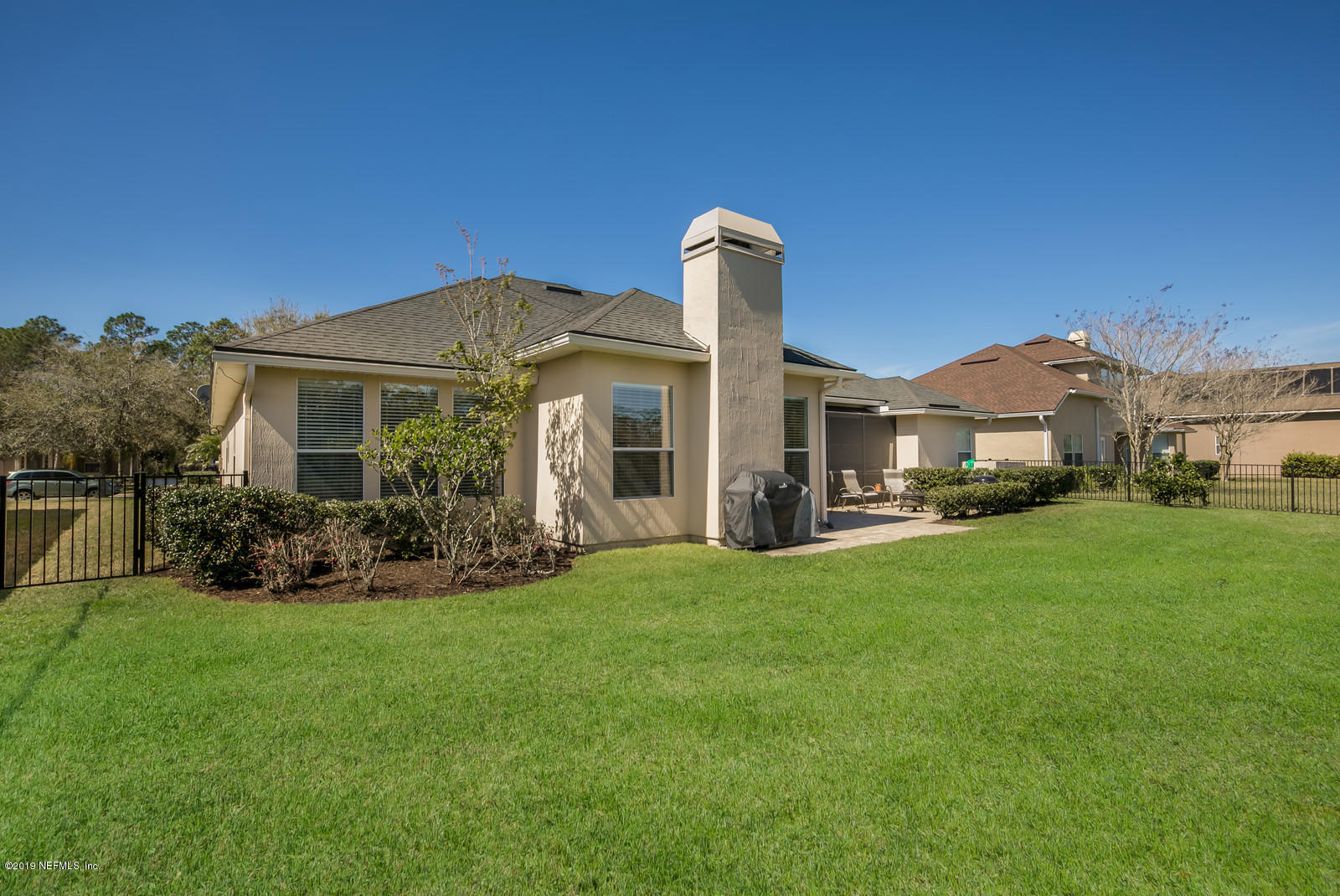 2034 River's Own Road St. Augustine, FL 32092 - Photo 36 of 40 a front view of a house with a garden and yard