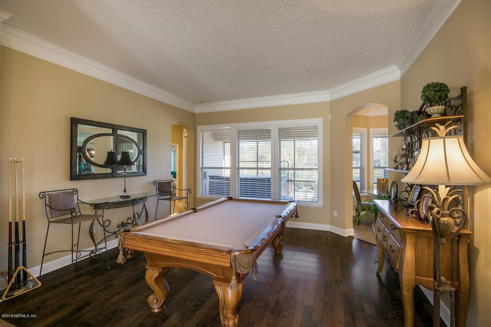 2034 River's Own Road St. Augustine, FL 32092 - Photo 9 of 40 a living room with furniture a table and wooden floor