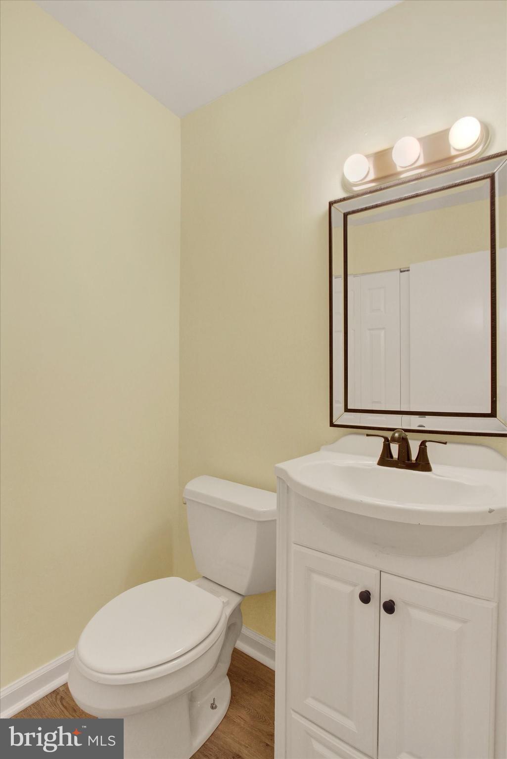 108 Walnut Street Steelton, PA 17113 - Photo 11 of 26 a bathroom with a toilet sink and mirror