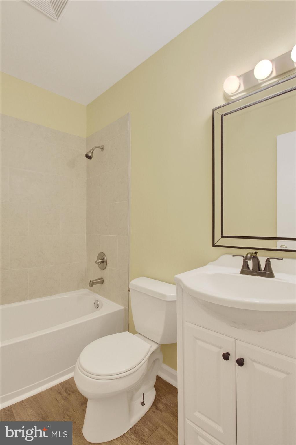 108 Walnut Street Steelton, PA 17113 - Photo 19 of 26 a bathroom with a sink a toilet and a mirror