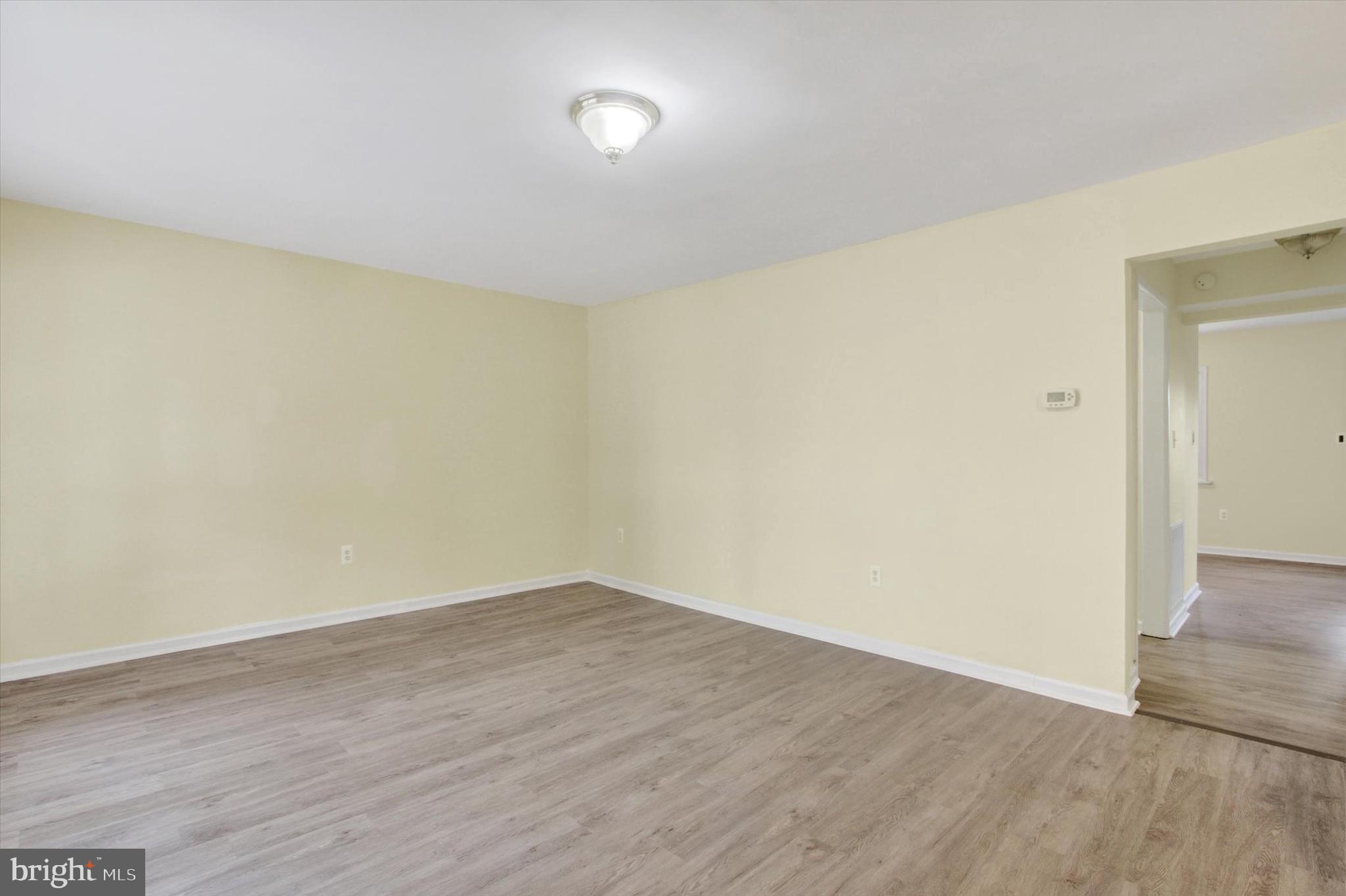 108 Walnut Street Steelton, PA 17113 - Photo 4 of 26 a view of an empty room with wooden floor
