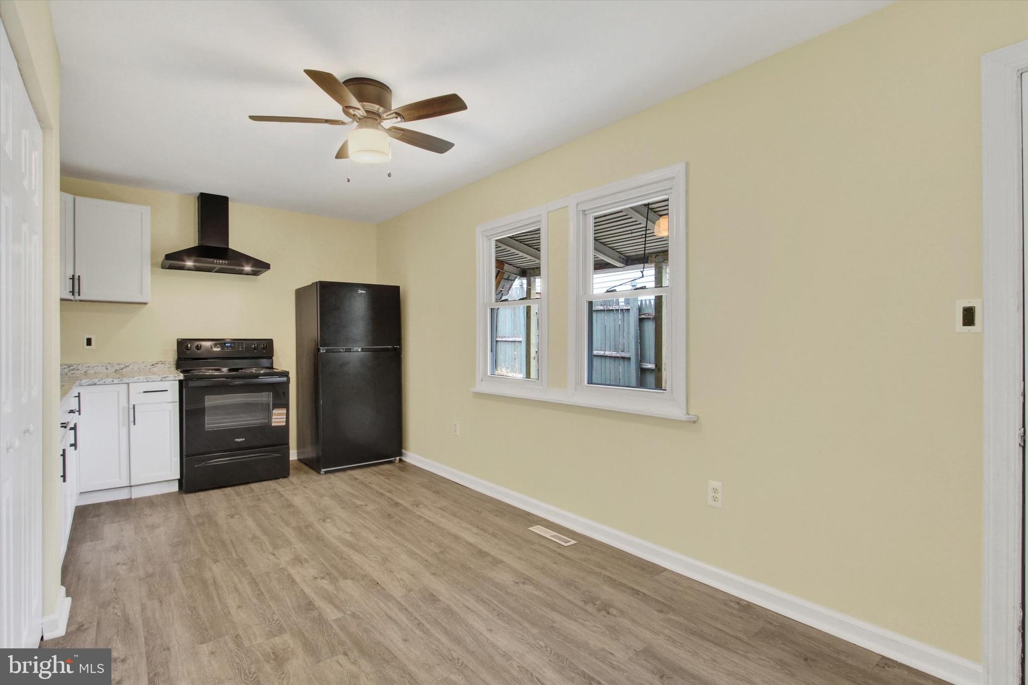 108 Walnut Street Steelton, PA 17113 - Photo 5 of 26 a kitchen with stainless steel appliances a refrigerator and a stove top oven