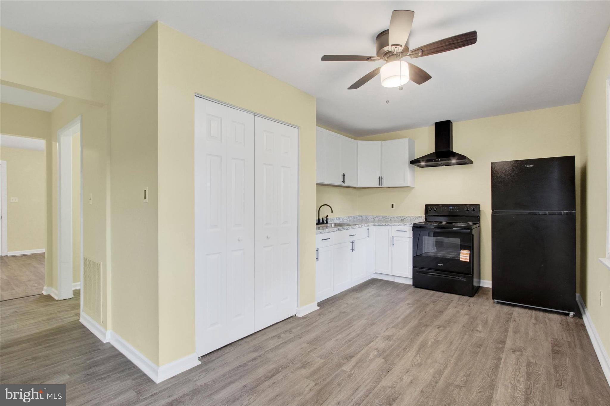 108 Walnut Street Steelton, PA 17113 - Photo 6 of 26 a kitchen with a refrigerator and a sink