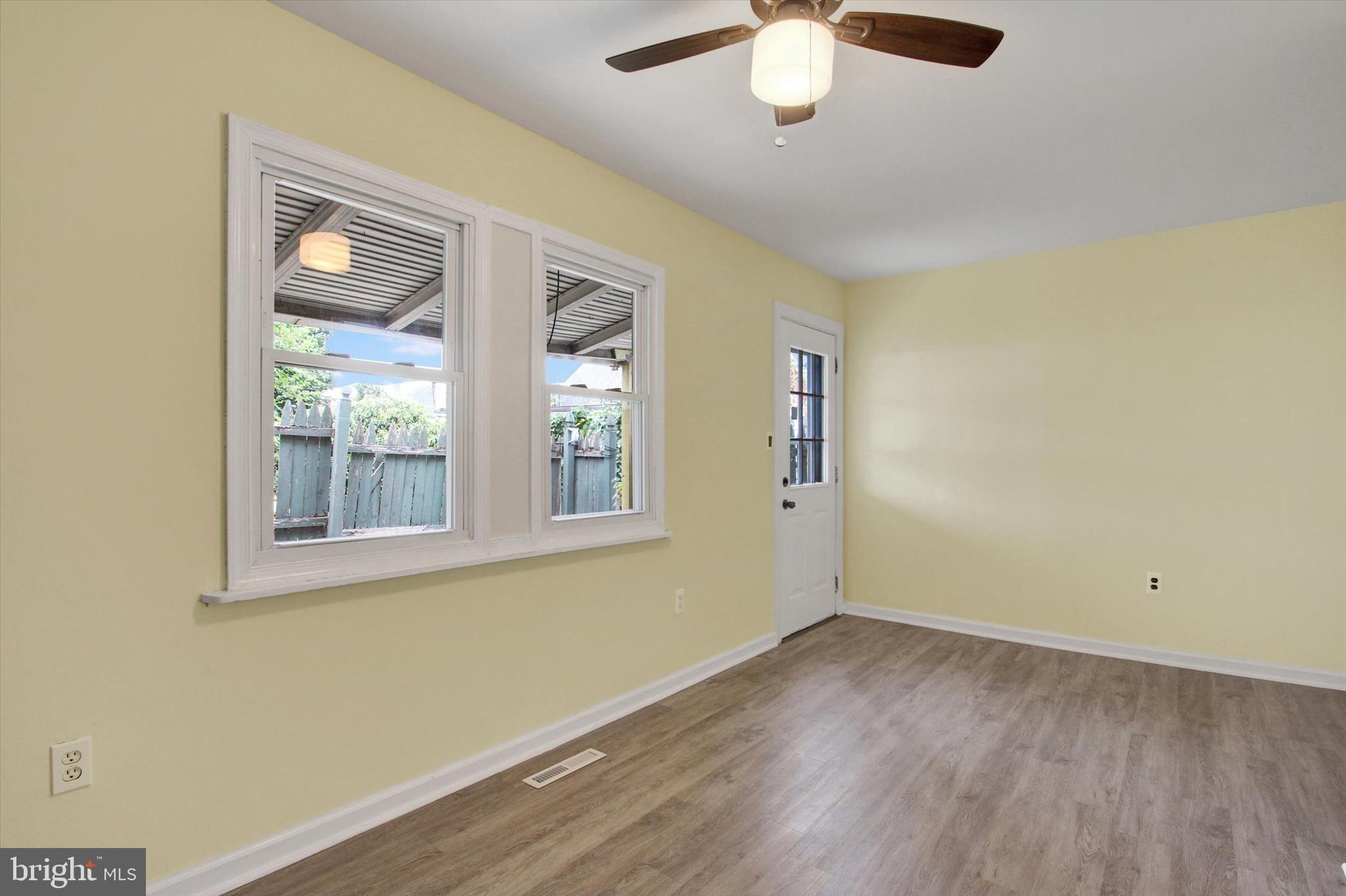 108 Walnut Street Steelton, PA 17113 - Photo 9 of 26 an empty room with a window and wooden floor