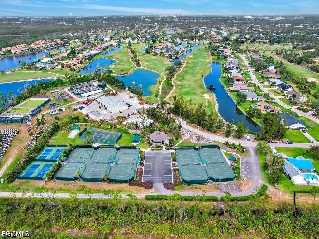 16560 Partridge Place Road, Unit 101 Fort Myers, FL 33908 - Photo 25 of 27 an aerial view of residential houses with outdoor space
