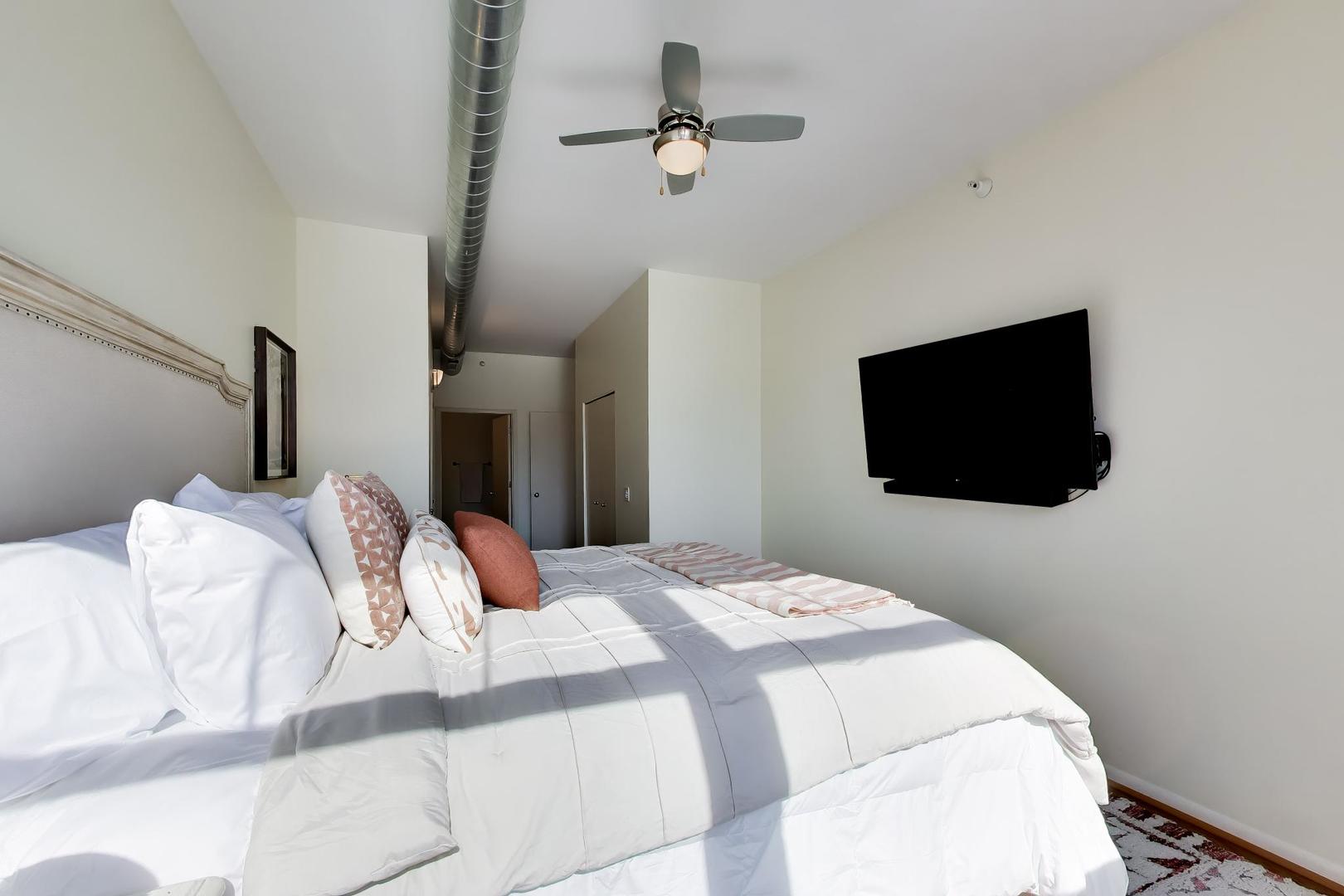 1200 West Monroe Street, Unit 502 Chicago, IL 60607 - Photo 14 of 34 a bedroom with a bed and a flat screen tv