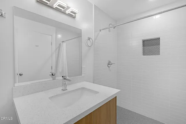 a view of an entryway with wooden floor and garden