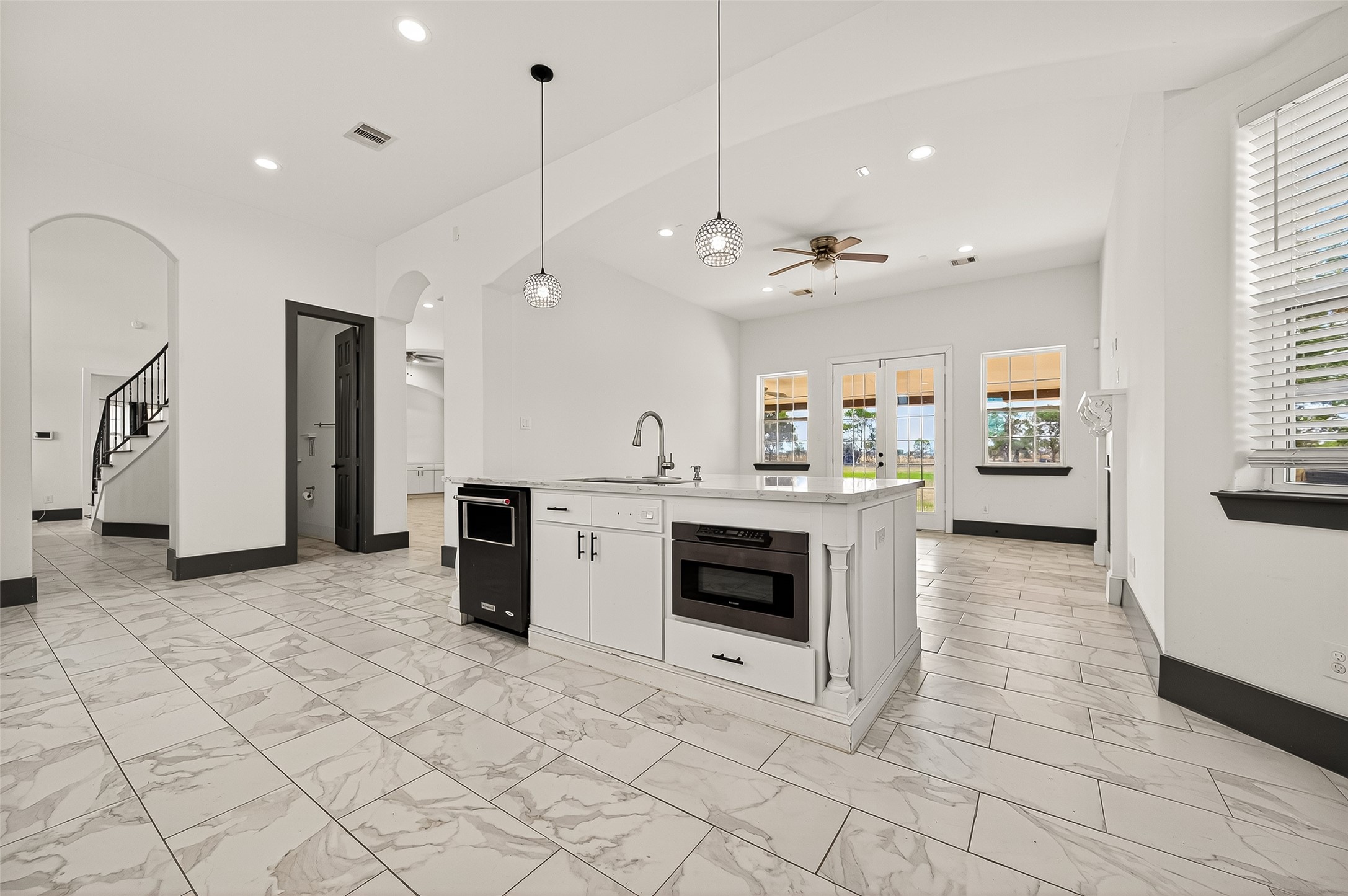 7915 Kirk Road Rosenberg, TX 77471 - Photo 16 of 46 a view of a kitchen with a sink a stove and cabinets