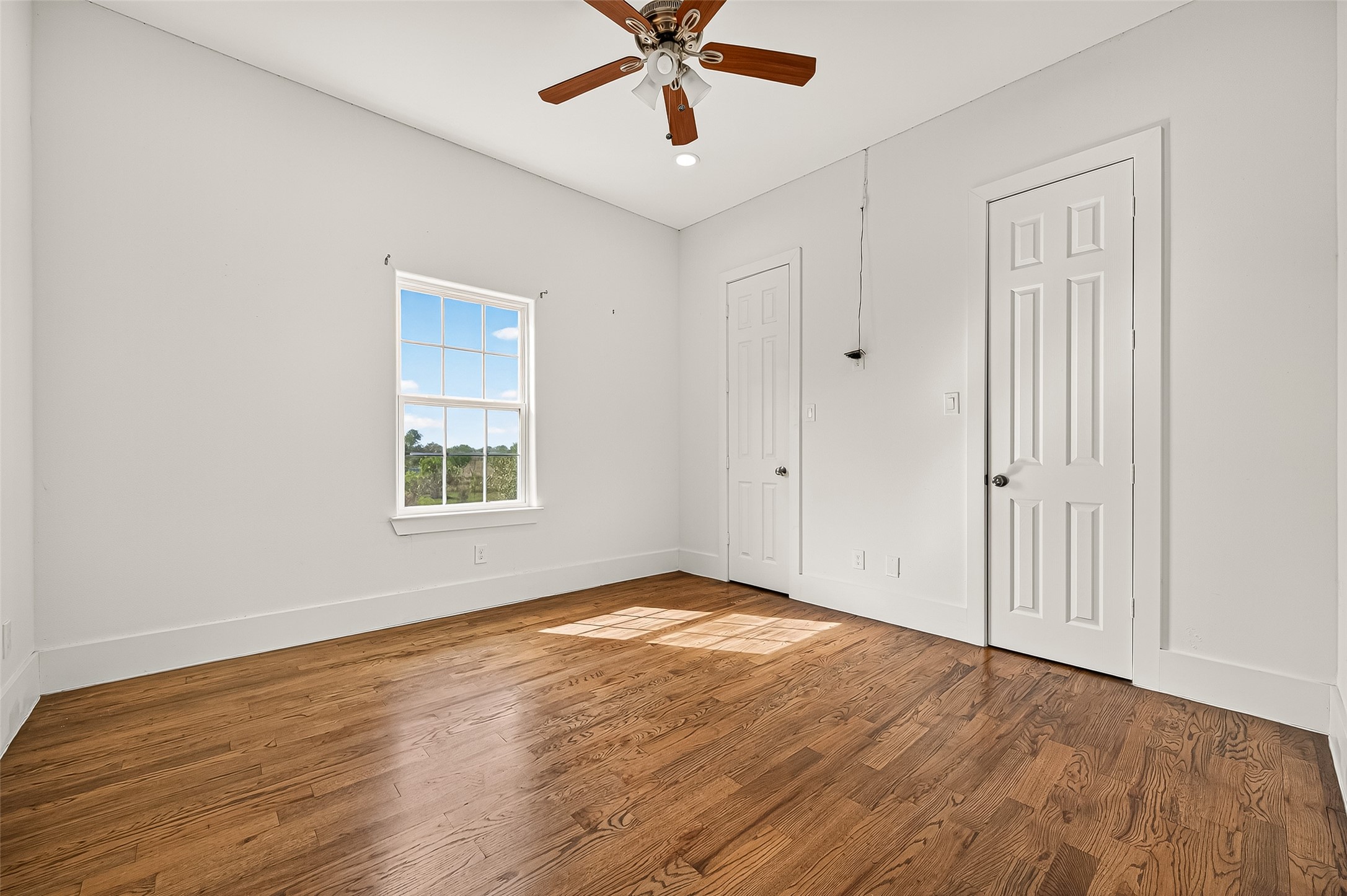 7915 Kirk Road Rosenberg, TX 77471 - Photo 20 of 28 This modern bathroom features a spacious walk-in shower with herringbone tile, a sleek vanity with ample storage, a large mirror, and elegant marble-patterned flooring. Natural light enhances the bright and airy feel.