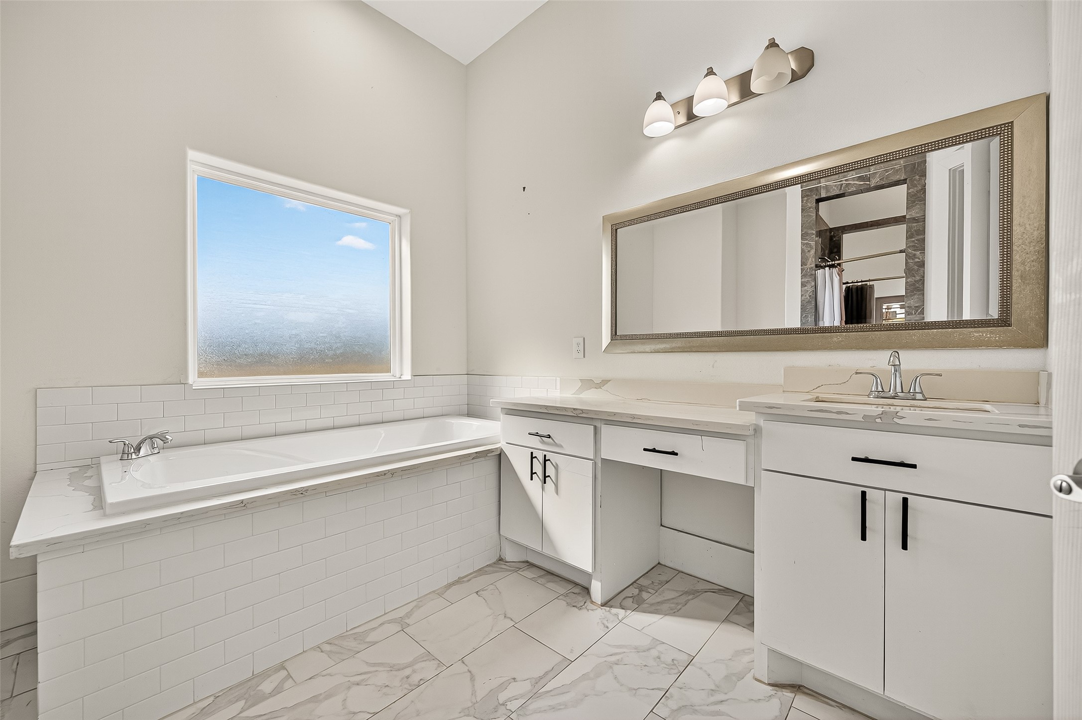 7915 Kirk Road Rosenberg, TX 77471 - Photo 23 of 46 a bathroom with a sink vanity and mirror