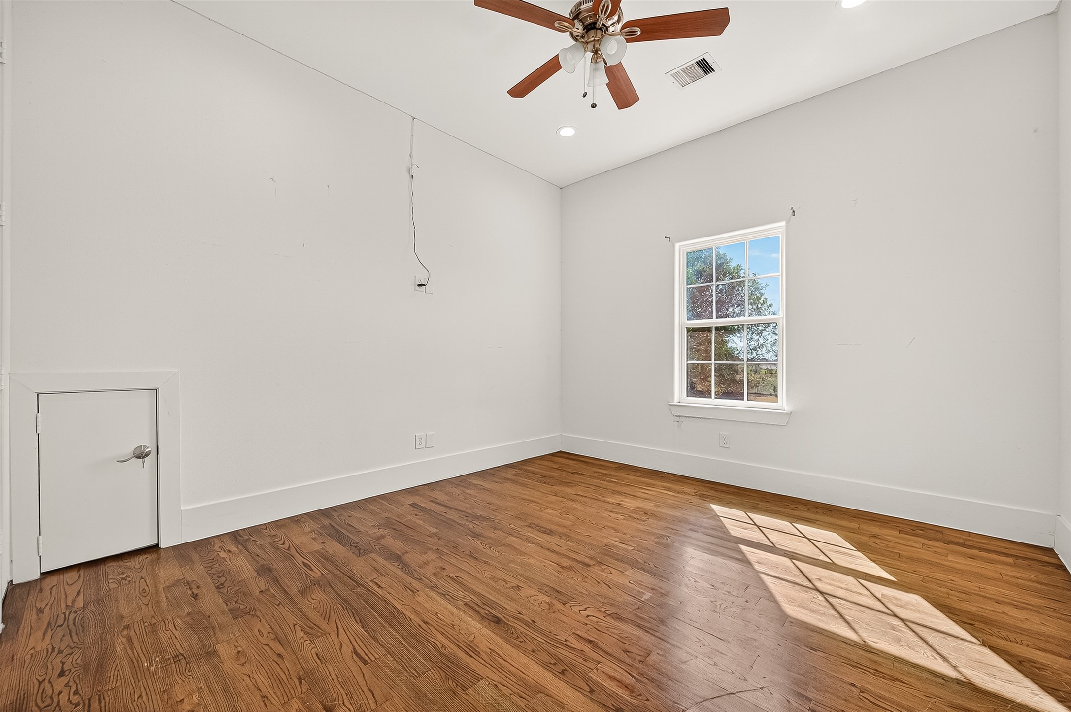 7915 Kirk Road Rosenberg, TX 77471 - Photo 28 of 46 wooden floor in an empty room with a window