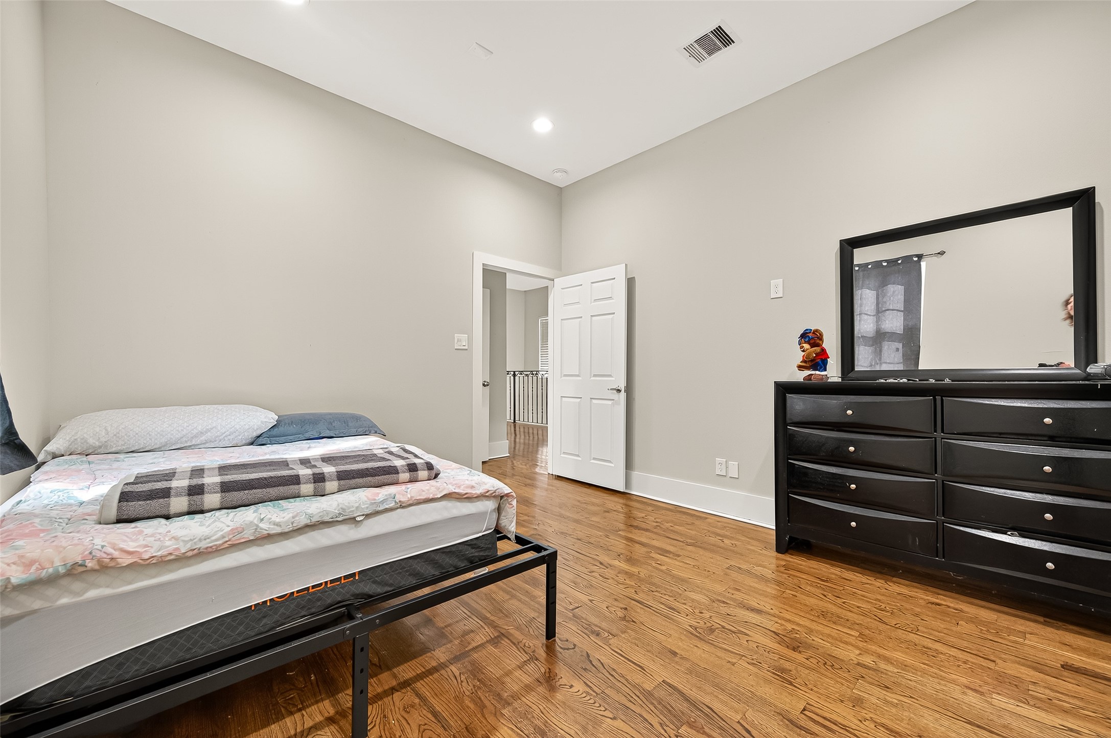 7915 Kirk Road Rosenberg, TX 77471 - Photo 40 of 46 a bedroom with a bed and a dresser