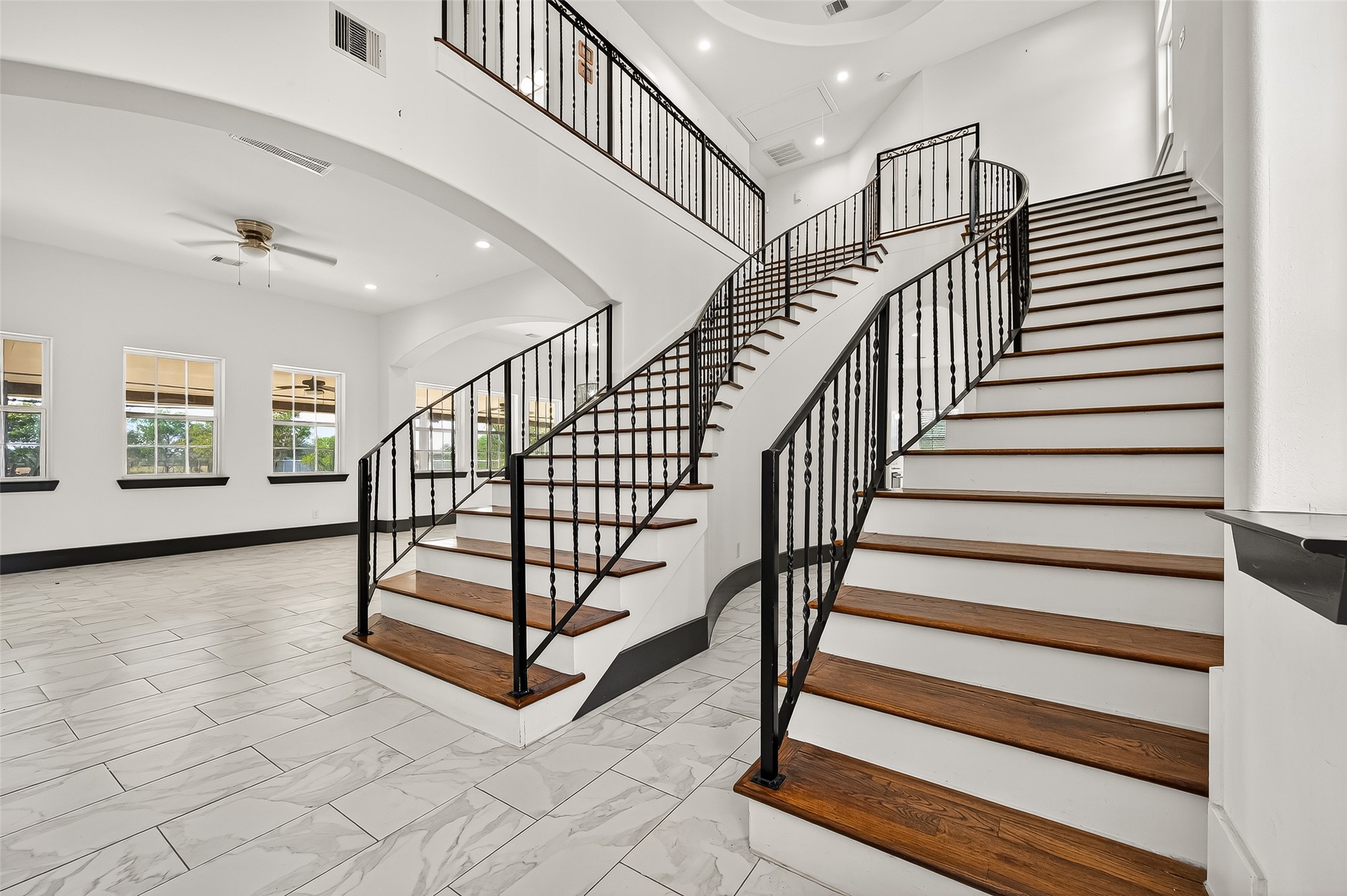 7915 Kirk Road Rosenberg, TX 77471 - Photo 5 of 46 a view of staircase with white walls and a window