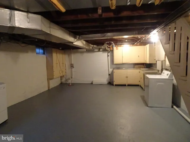 a view of a storage & utility room with washer and dryer