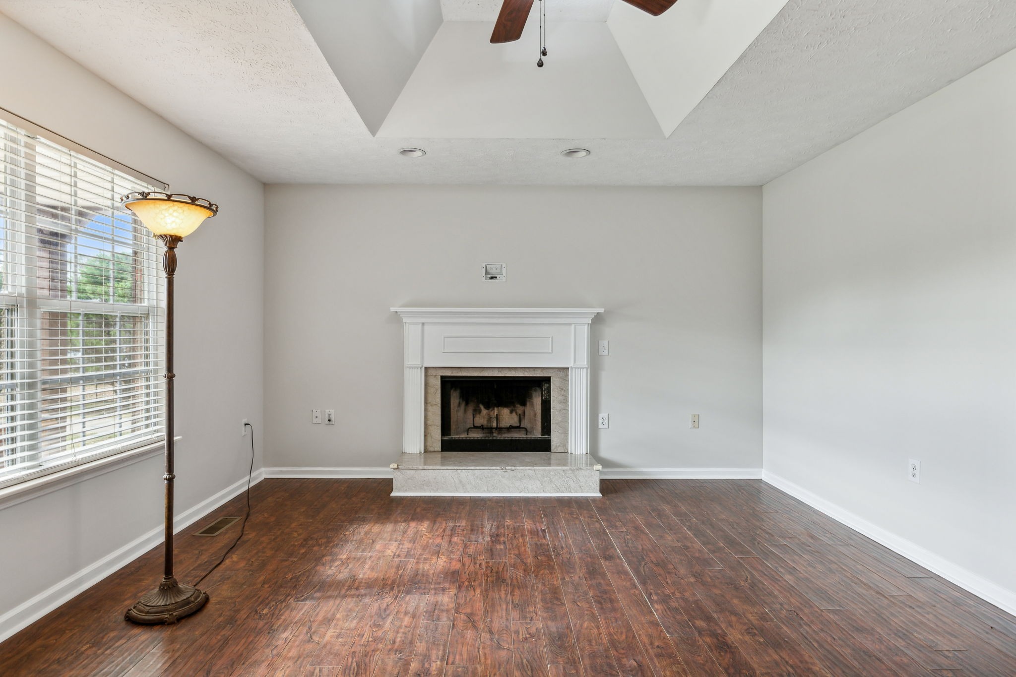 633 Audrey Road Mount Juliet, TN 37122 - Photo 8 of 30 a view of an empty room with a fireplace and a window