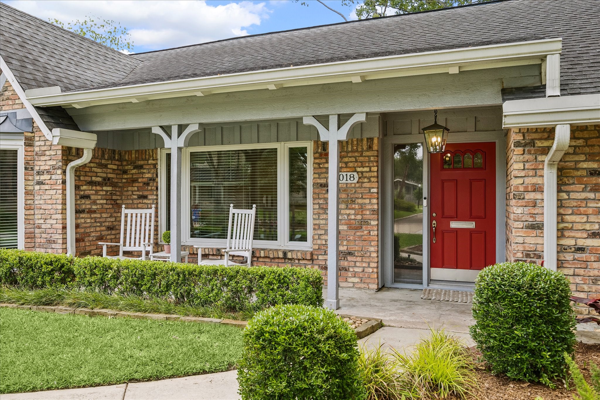 1018 Ben Hur Drive Spring Valley Village, TX 77055 - Photo 2 of 30 A charming front porch offers the perfect spot to sit and relax, watch loved ones play, and greet neighbors.