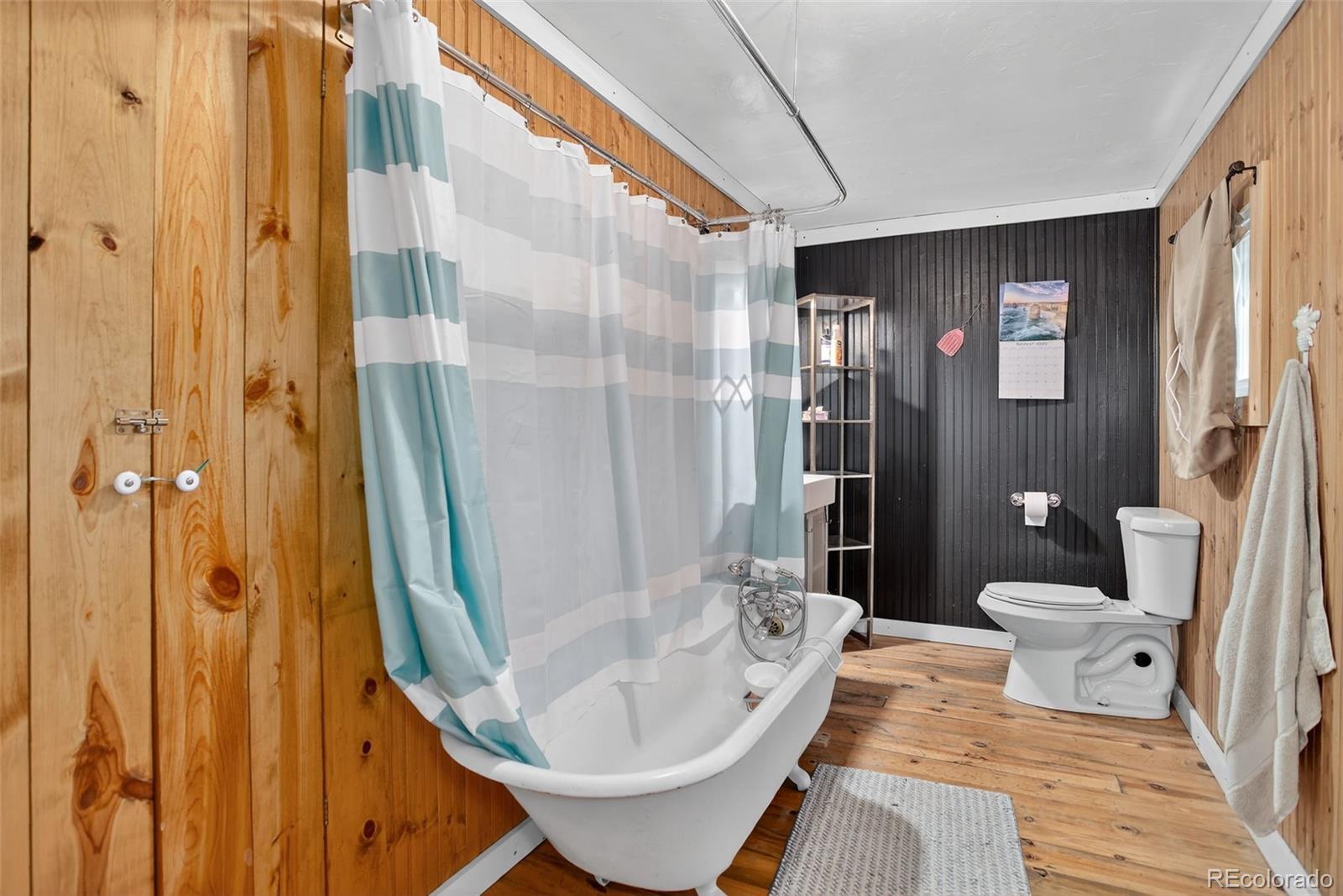 27403 Schuyler Gulch Road Pine, CO 80470 - Photo 12 of 40 a bathroom with a sink toilet and shower