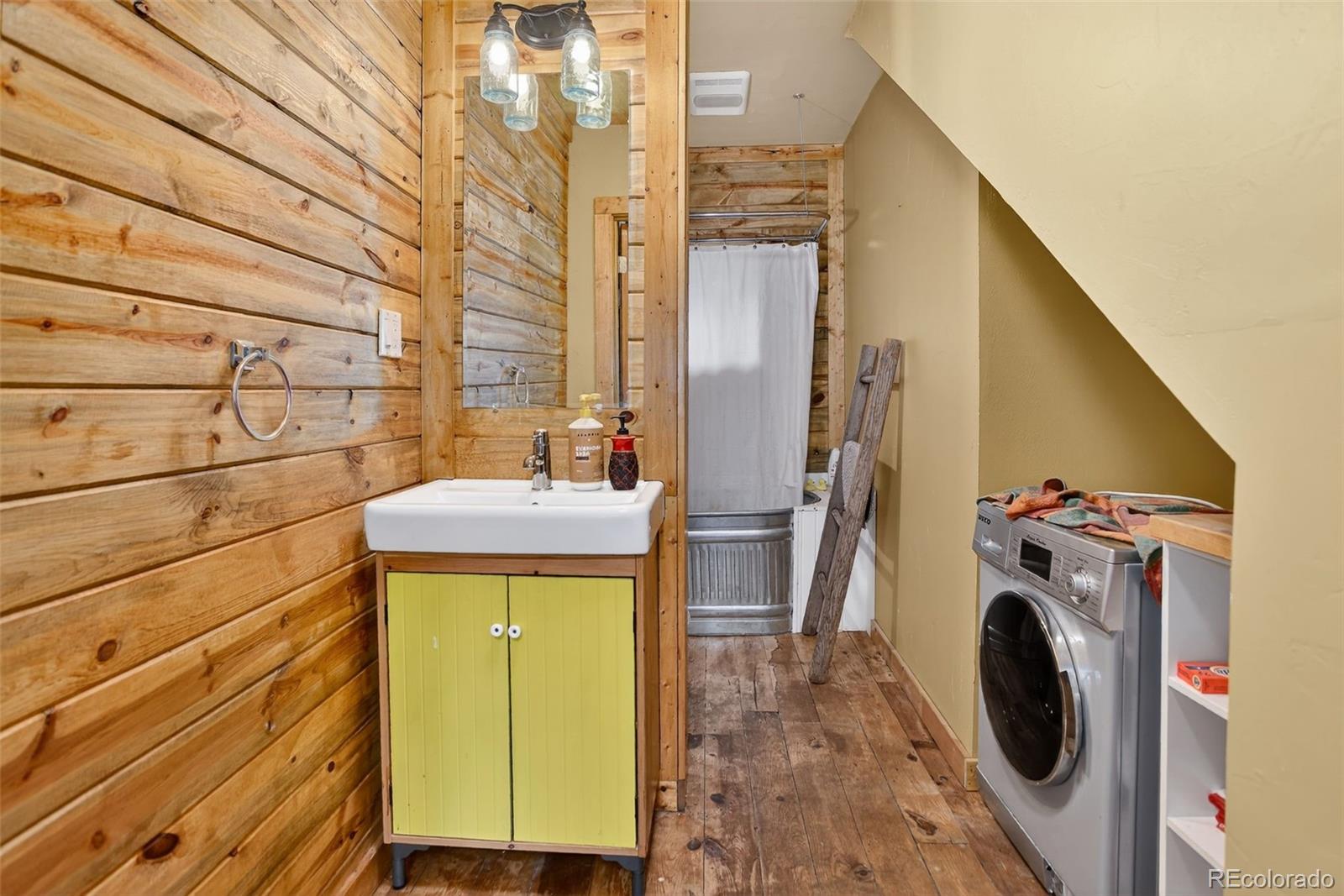 27403 Schuyler Gulch Road Pine, CO 80470 - Photo 13 of 40 a utility room with dryer and washer