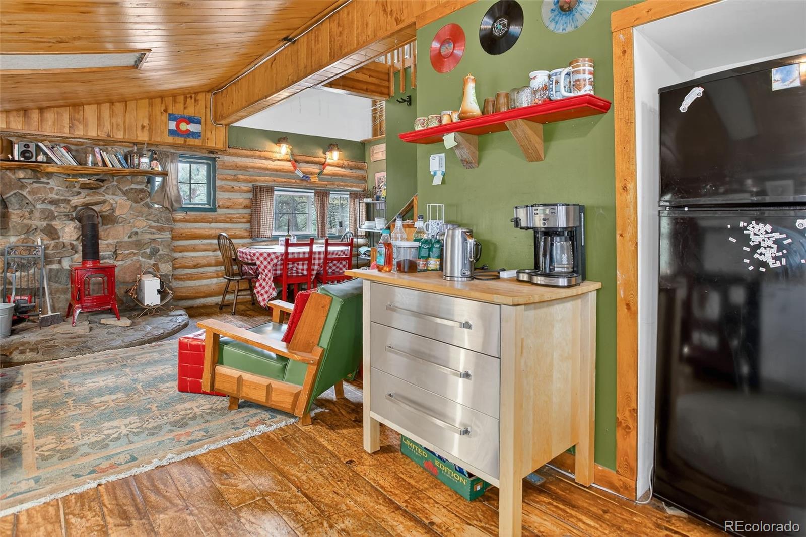 27403 Schuyler Gulch Road Pine, CO 80470 - Photo 4 of 40 a room with lots of storage and a potted plant