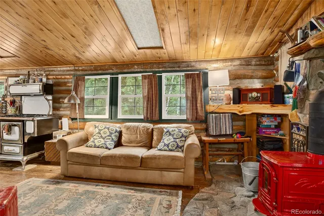 a view of a chair and table in backyard