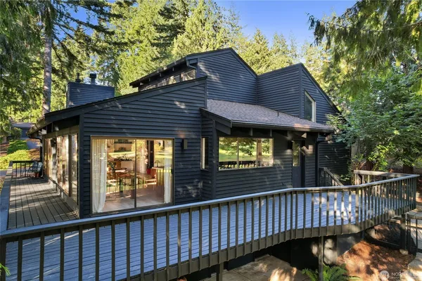a house that has a tree in front of it