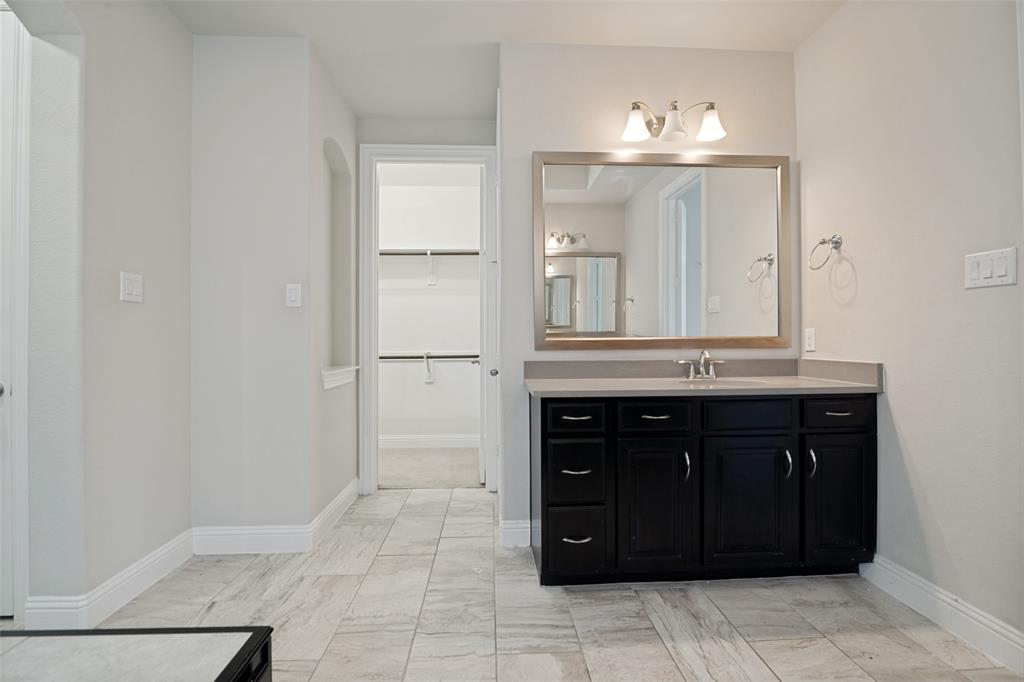 2802 Merlot Circle Rowlett, TX 75088 - Photo 23 of 40 a bathroom with a sink vanity and a mirror