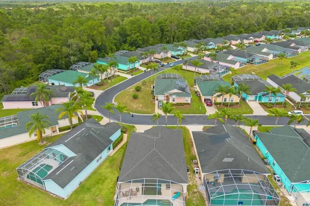 an aerial view of a house with a swimming pool