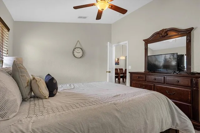 a bedroom with bed and a window