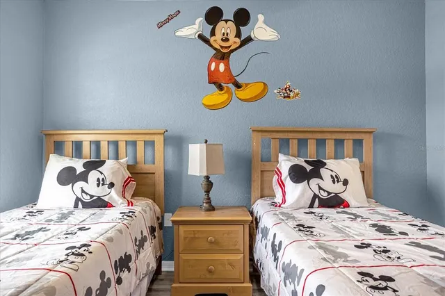 a view of a hallway with wooden floor and table