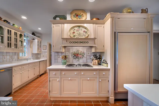 a view of a kitchen with a sink and cabinets