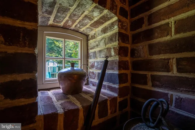 a view of a chair and table in the room