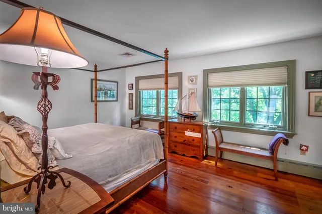 a bed room with a bed and a window