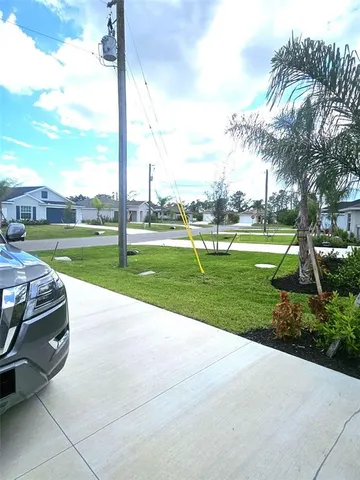 a house view with a backyard space