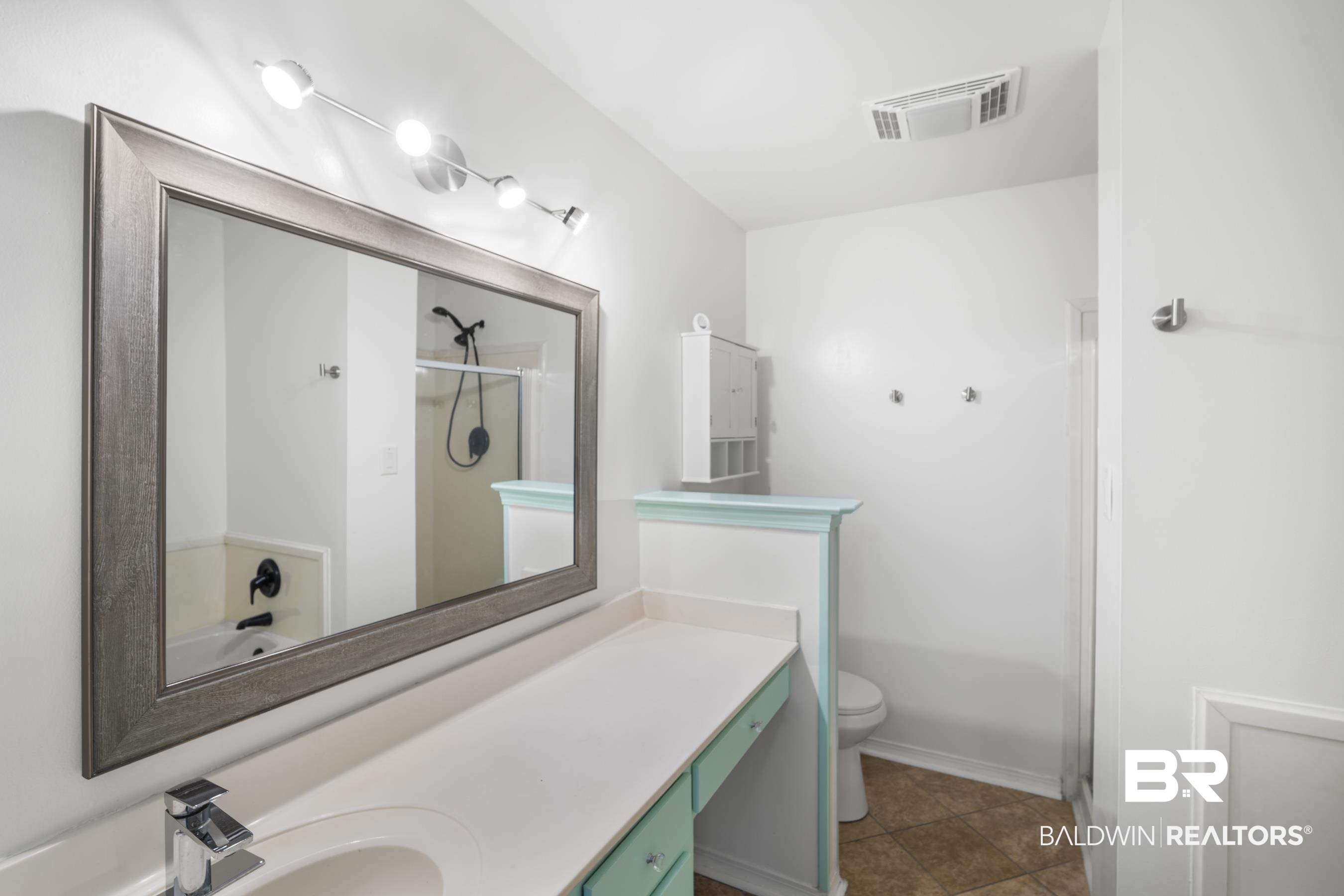 3101 Autumn Ridge Drive West Mobile, AL 36695 - Photo 18 of 36 Full bathroom with vanity and dark tile patterned flooring