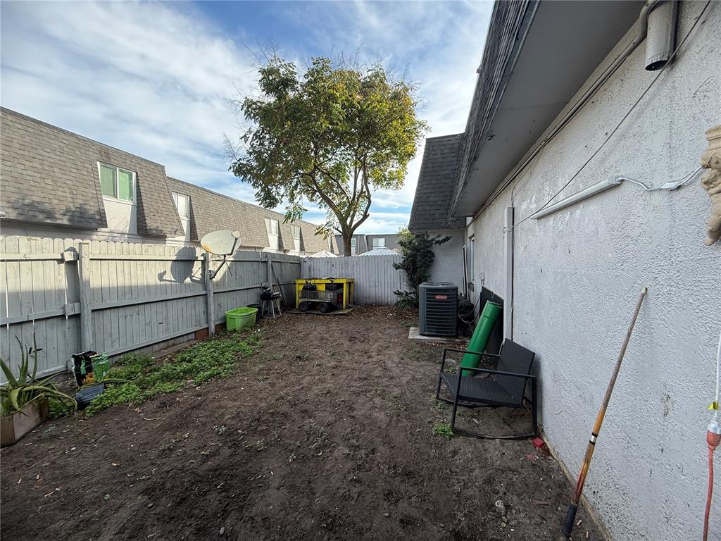 1944 South Conway Road, Unit 3 Orlando, FL 32812 - Photo 16 of 20 a view of a house with backyard and sitting area