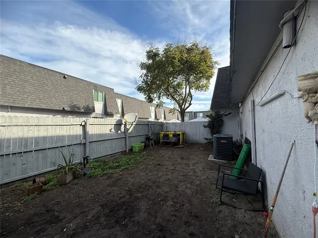 a swimming pool with outdoor seating and yard
