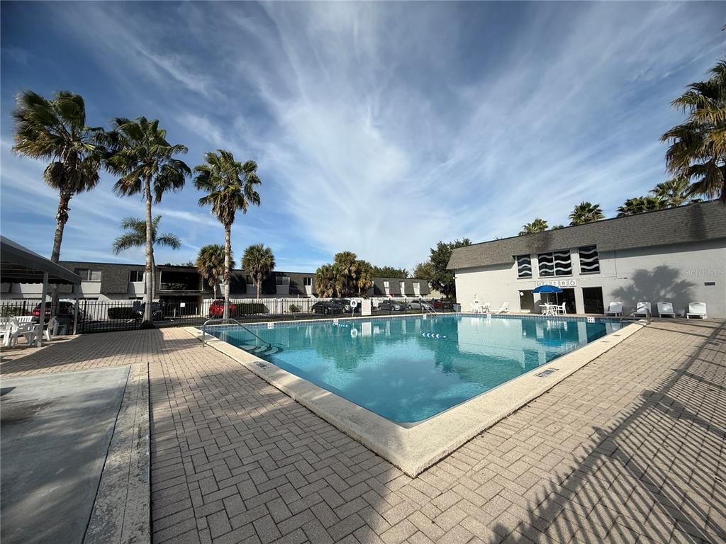 1944 South Conway Road, Unit 3 Orlando, FL 32812 - Photo 18 of 20 a swimming pool with outdoor seating and yard