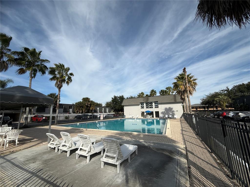 1944 South Conway Road, Unit 3 Orlando, FL 32812 - Photo 19 of 20 a swimming pool with outdoor seating and yard