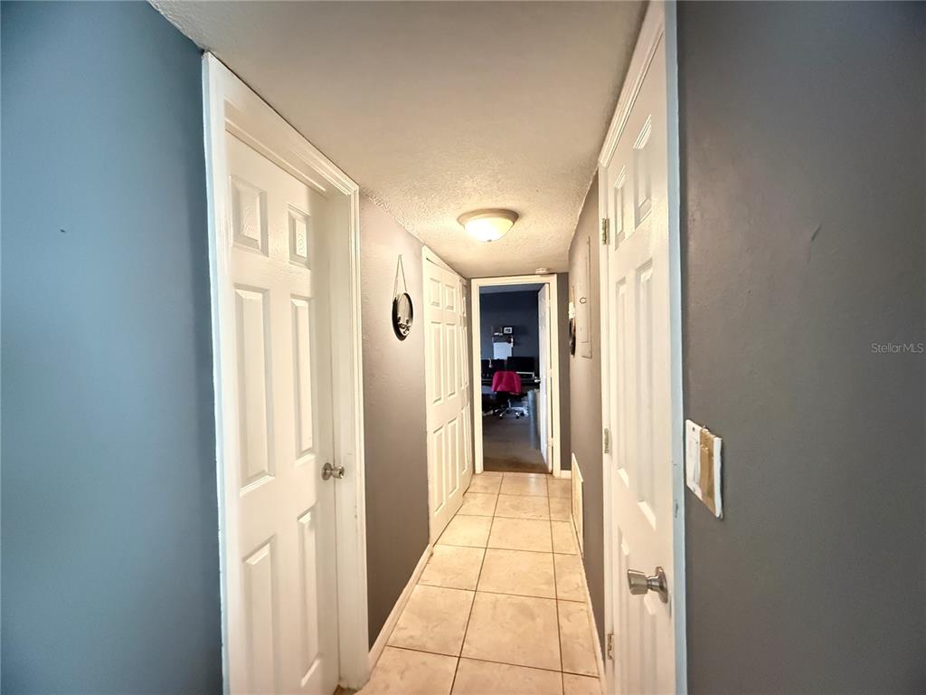1944 South Conway Road, Unit 3 Orlando, FL 32812 - Photo 7 of 20 a view of hallway with bathroom and a glass door