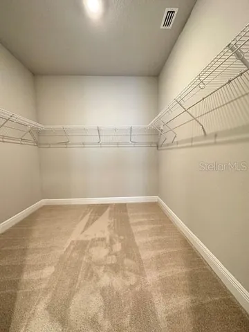 a view of a room with racks on the wall