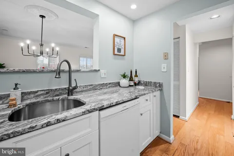a kitchen with sink and window